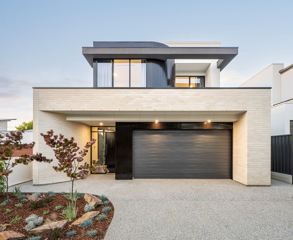 Grand Prize home April 2025 double story with cream brickwork with dark garage panelling